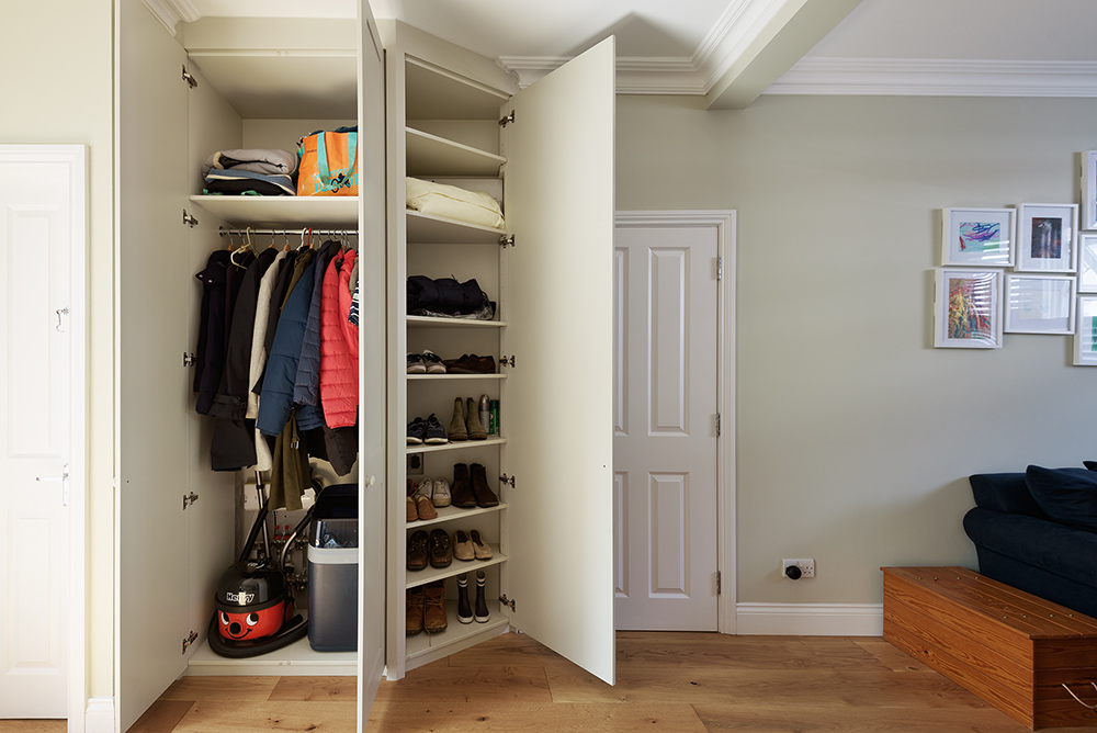 Inside of a corner bespoke wardrobe