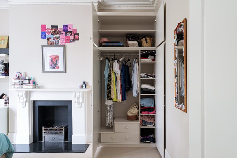 Inside a white alcove wardrobe