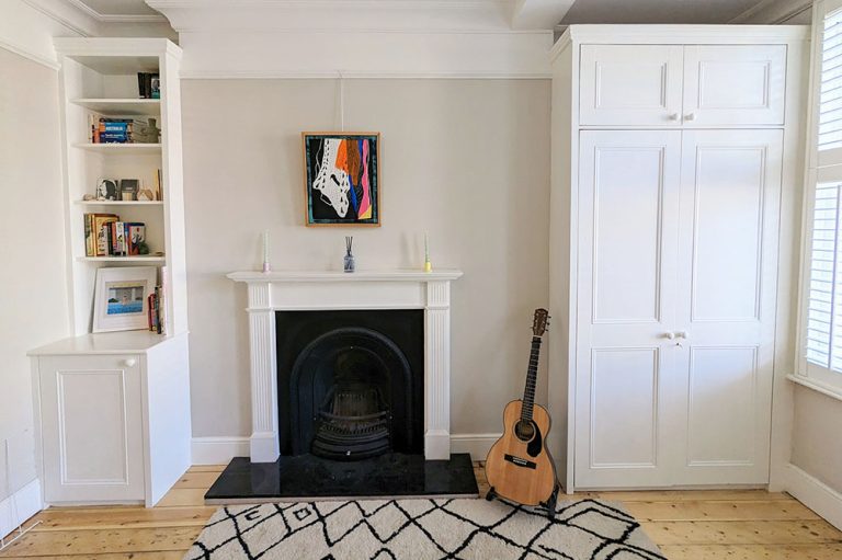 Fitted white alcove wardrobe and alcove cupboard