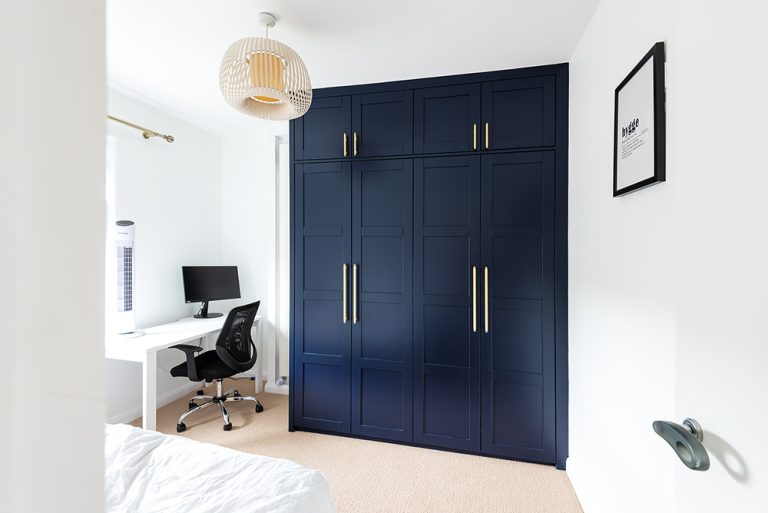 Built in blue wardrobe in spare room