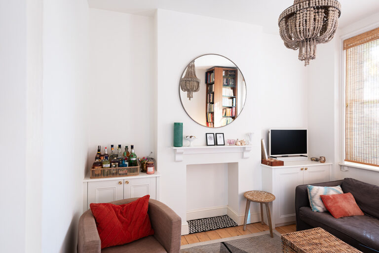 2 built in white alcove cupboards in living room