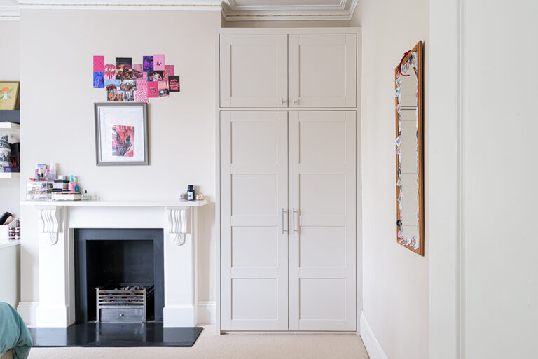 Fitted Alcove wardrobe next to fireplace