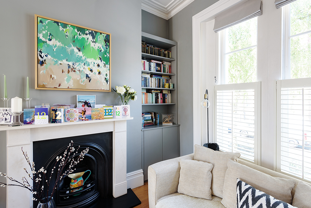 Blue alcove cupboard next to fireplace