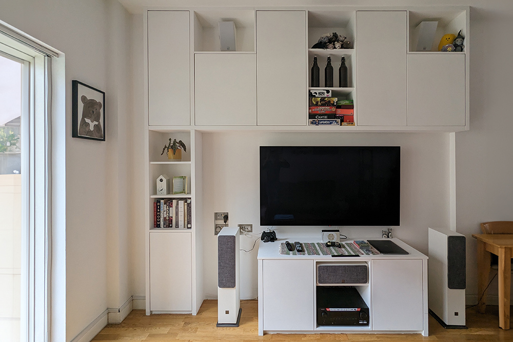 Built-in TV unit with lots of storage space, made with MDF and hand-painted