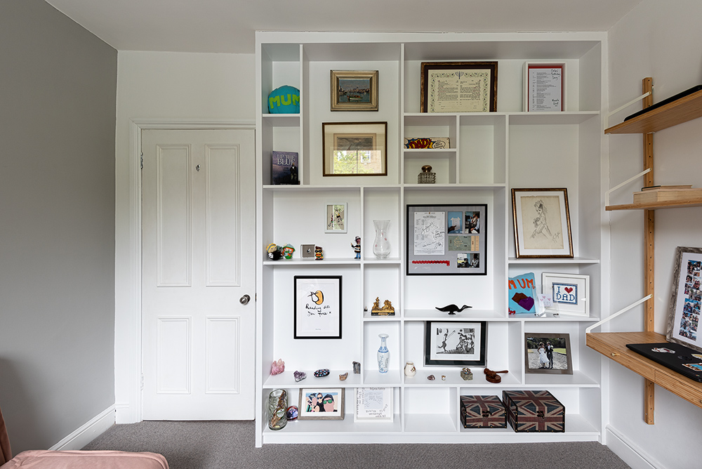 Built-in display unit with shelves to store trophies, certificates and personal items.