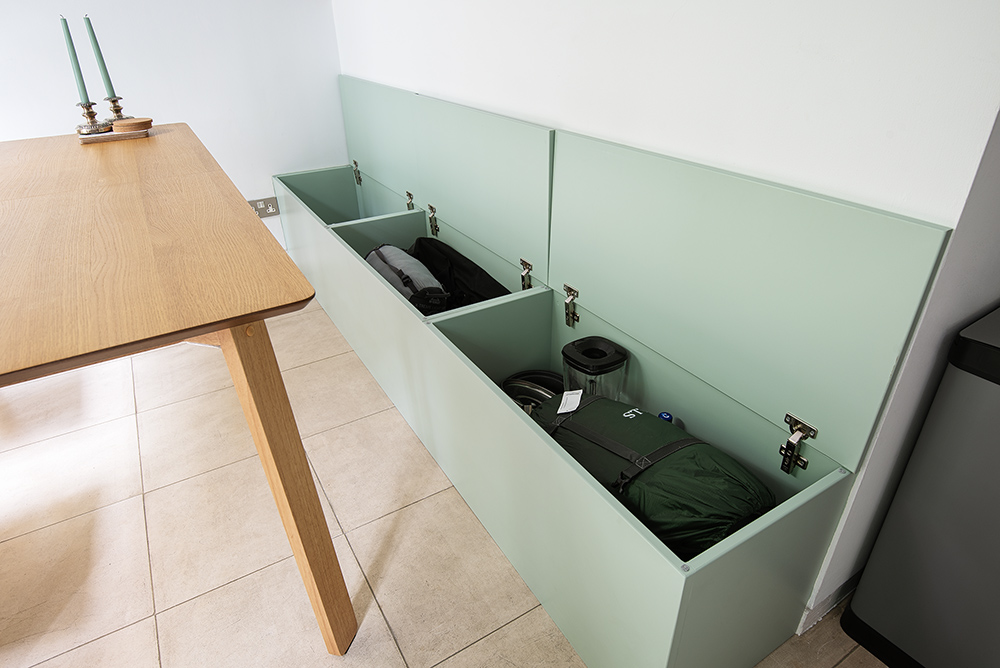 Built in green storage bench in kitchen