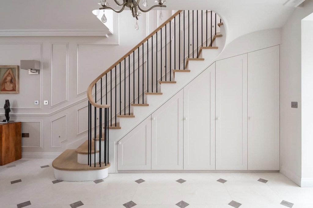 Large built in under stairs cupboard with 5 doors in beautiful hallway