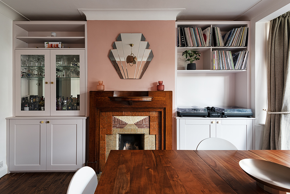 Built-in alcove cupboards and shelving in living room designed to store a drinks section and place vinyl's.