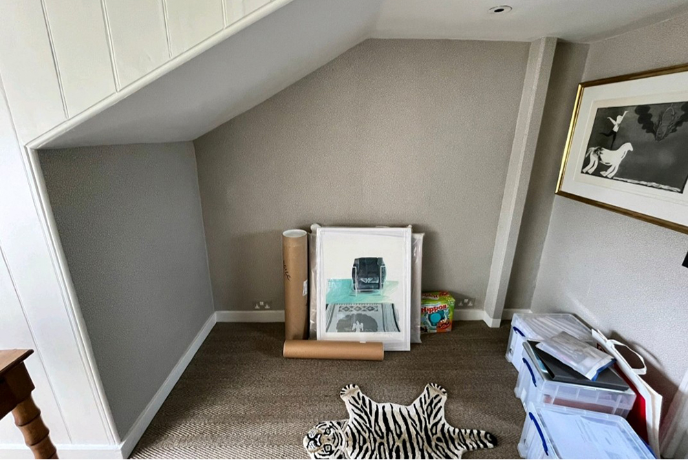 Before installation picture of a built-in wardrobe and desk