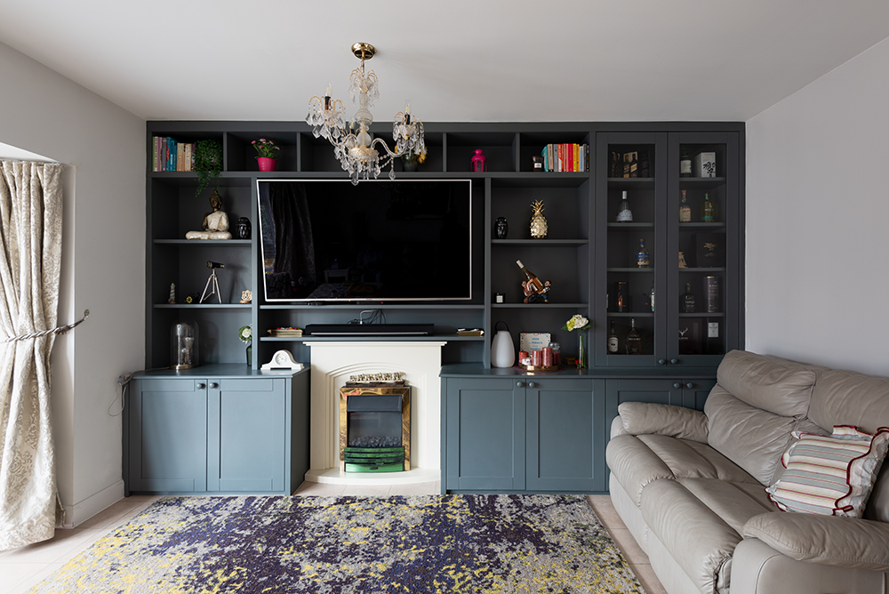 Wall to wall built in TV and Media unit with cupboards and shelving.