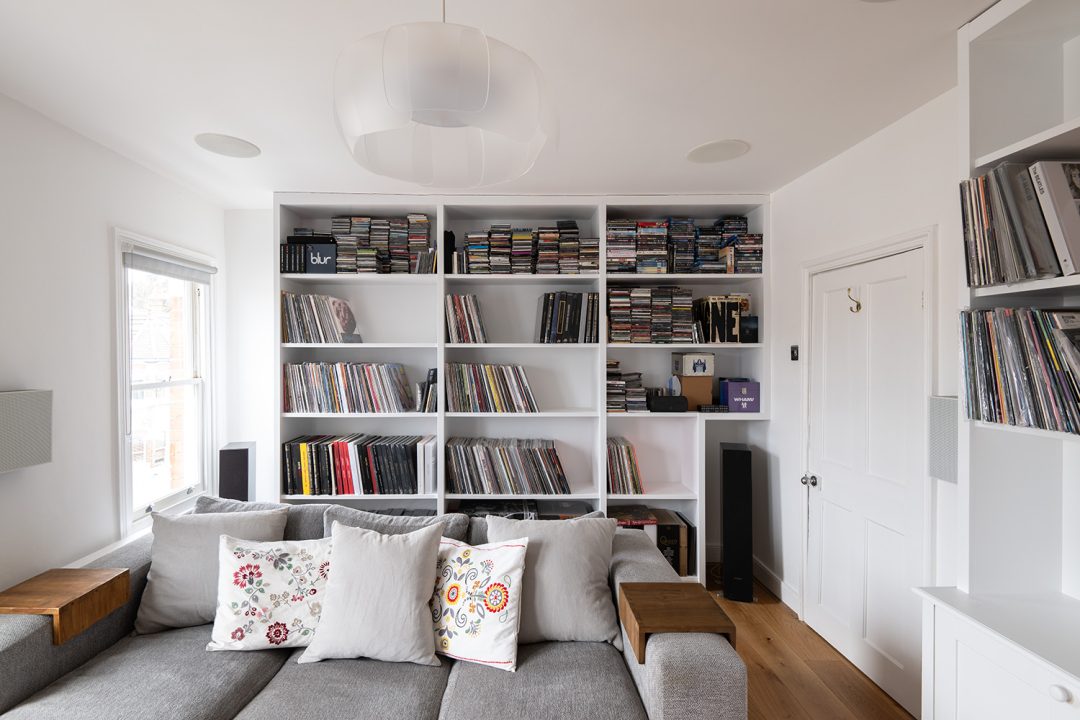 Built in cupboard and shelving to store music records