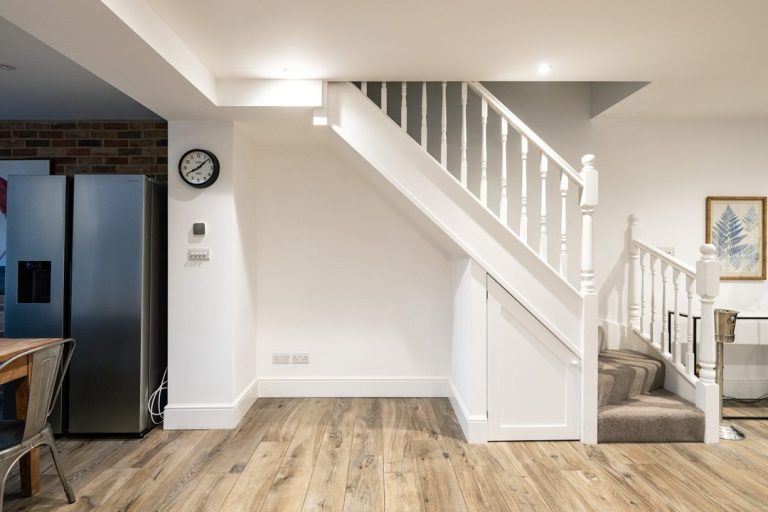 Before picture of under stairs storage area