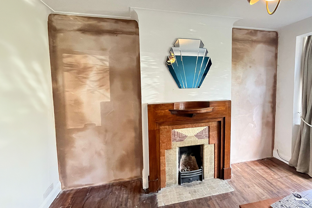 Before picture of a living room with empty alcove spaces