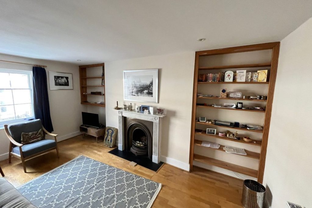 Before picture of replacement bookcases in living room