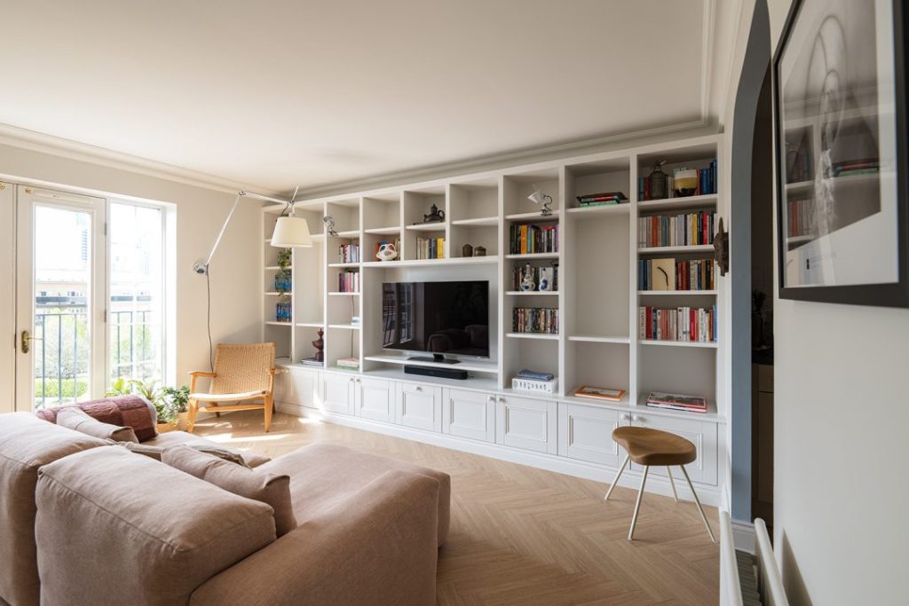 Large wall to wall built in TV unit with lots of storage space in a living room