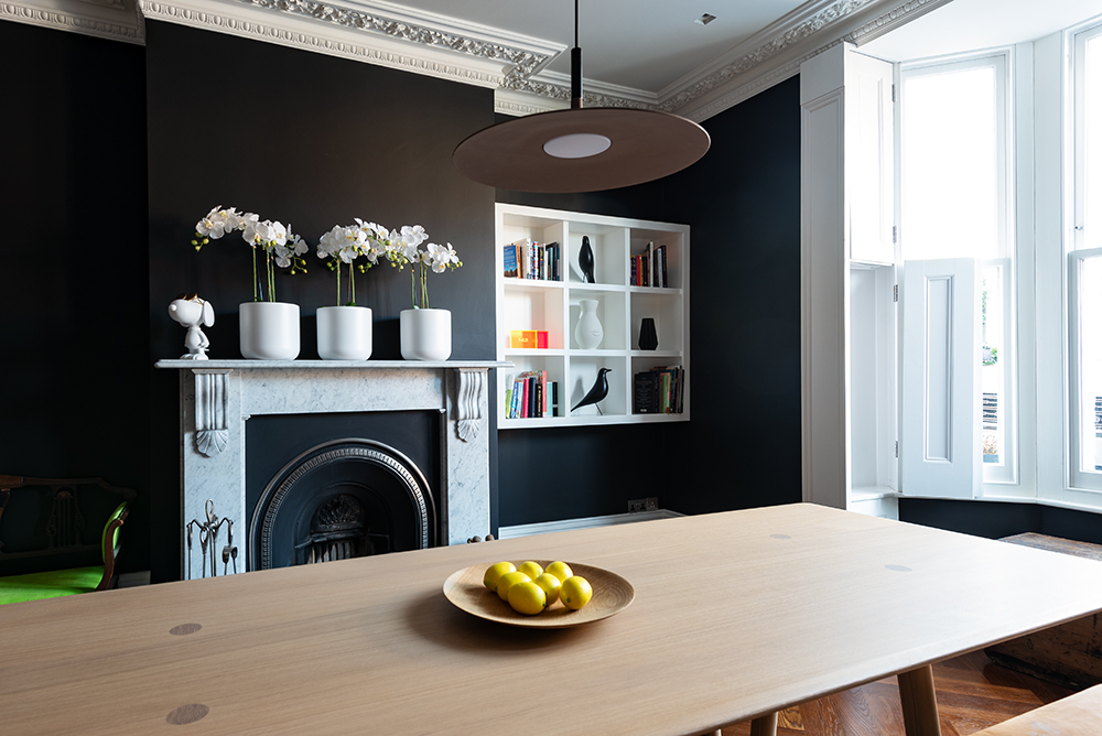 White shelving unit in alcove space in living room