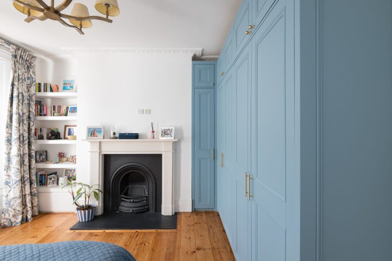 Large blue bespoke wardrobe with corner wardrobe