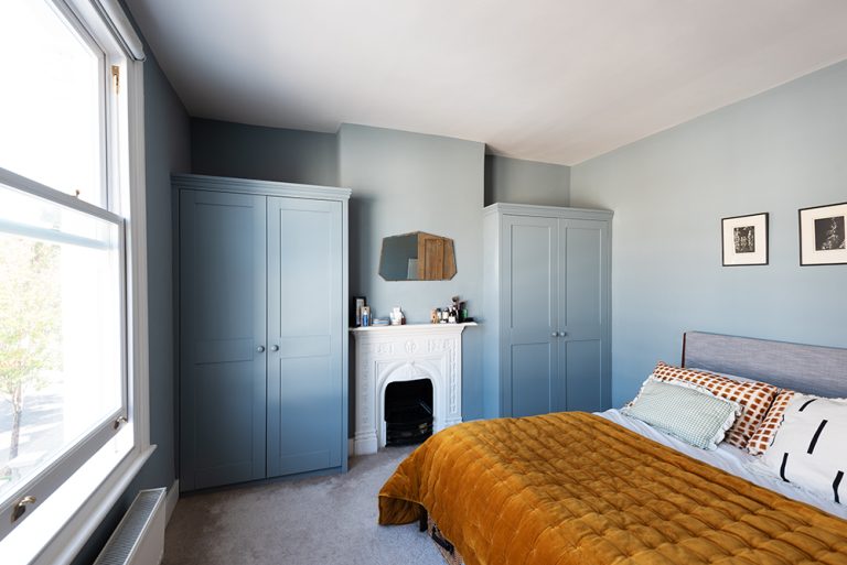 Bespoke alcove wardrobe, painted in blue.