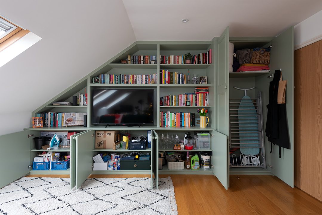 Built in bookshelf with plenty of storage cupboards