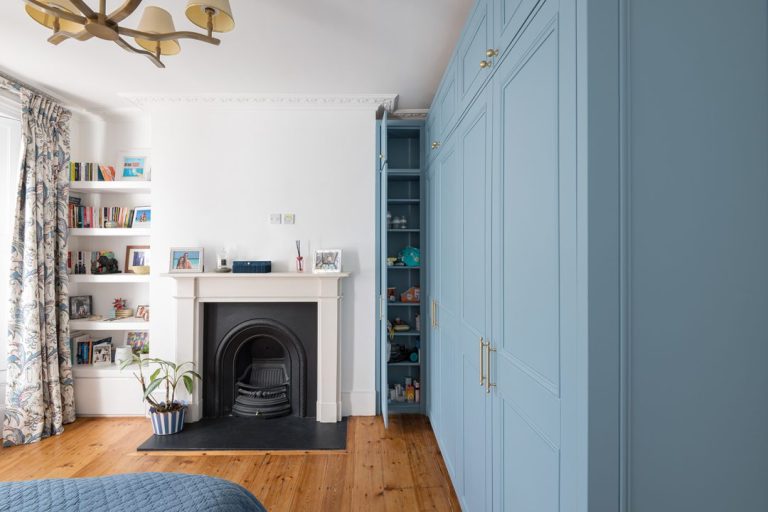 Blue corner walk in wardrobe, made with MDF and hand painted.