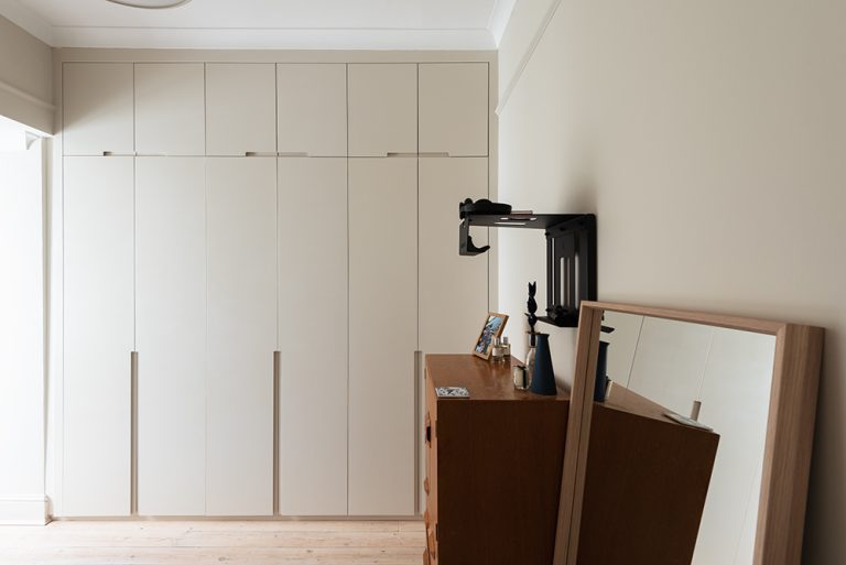 White bespoke wardrobe with 6 doors in bedroom