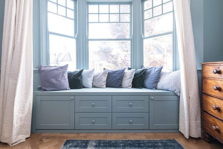 Blue window seat with storage