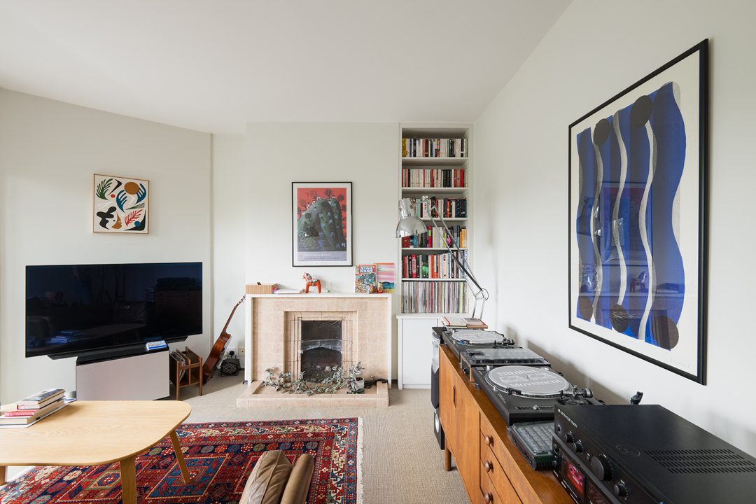 White cabinet with shelving unit for records