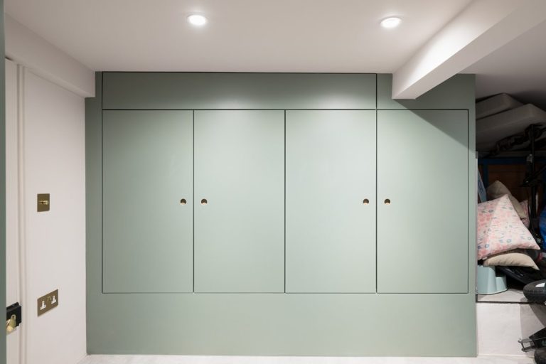 Green storage cupboards in basement