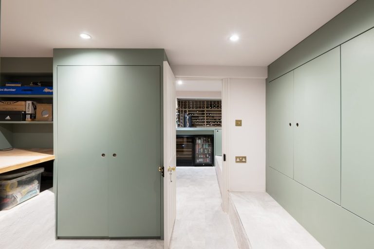 Door open to built in storage cupboard