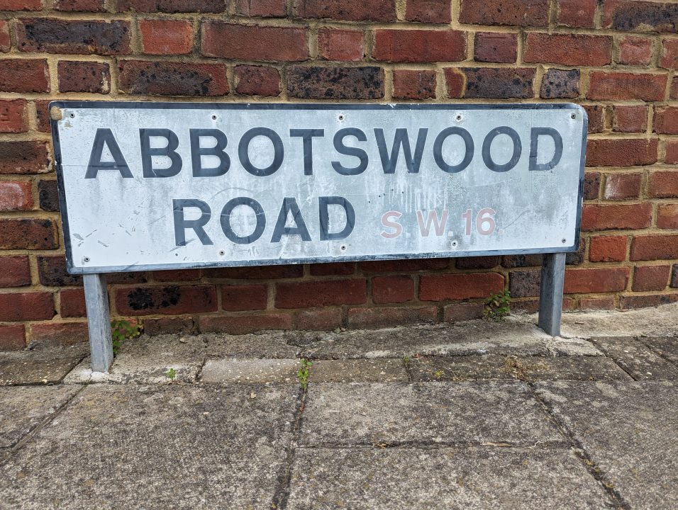 A white sign called Abbotswood in SW16