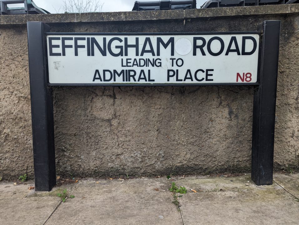 White road sign in a street in Haringey