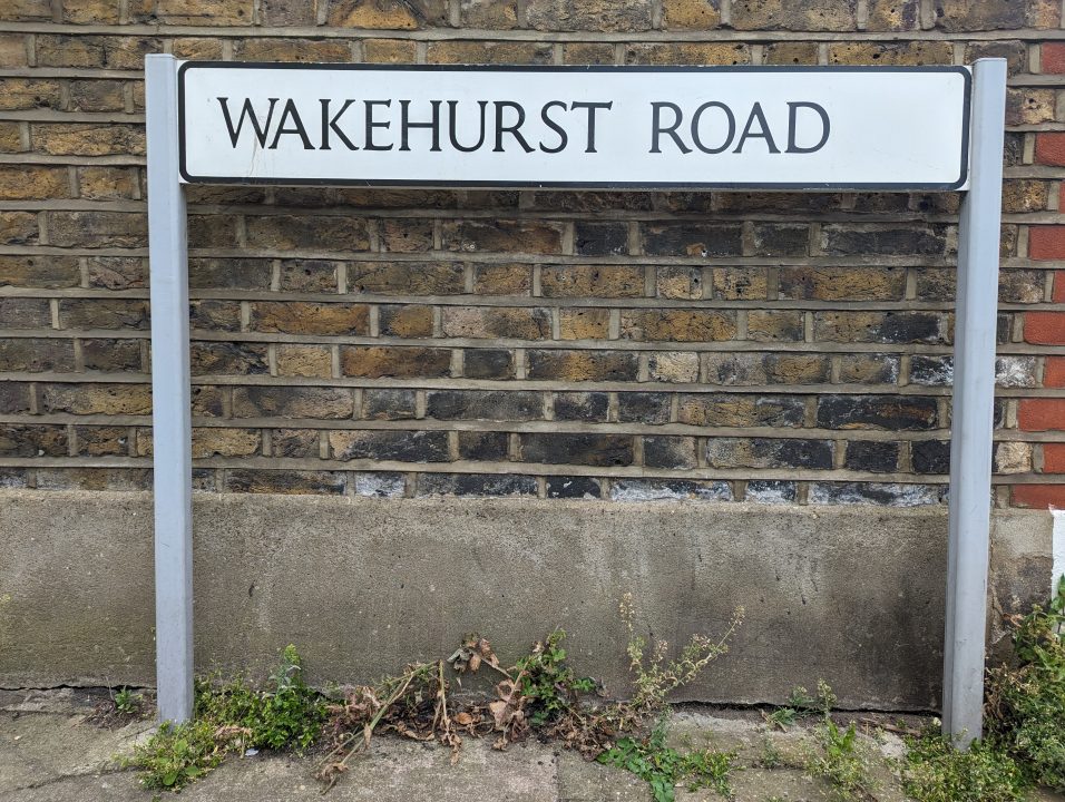 A white sign on a street in Clapham Common called Wakehurst Road