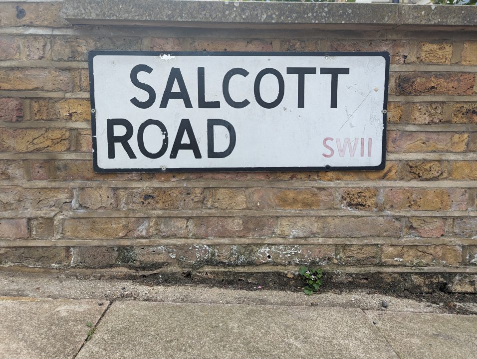 A sign of a road in Clapham Junctional called Salcott Road