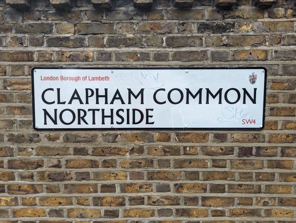 White road sign called Clapham Common Northside