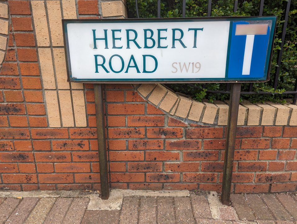 A street sign called Herbert road in Wimbledon