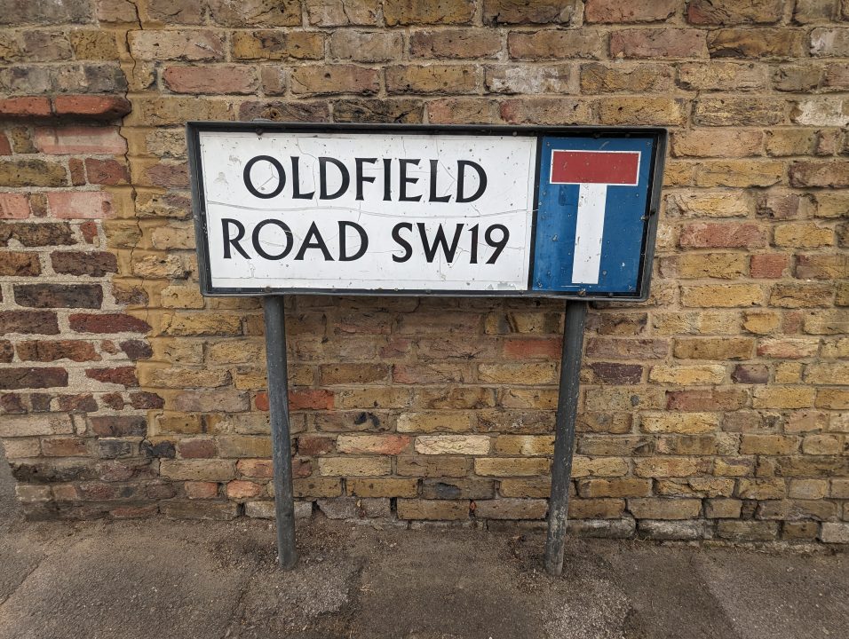 A road sign called Oldfield Road in SW19