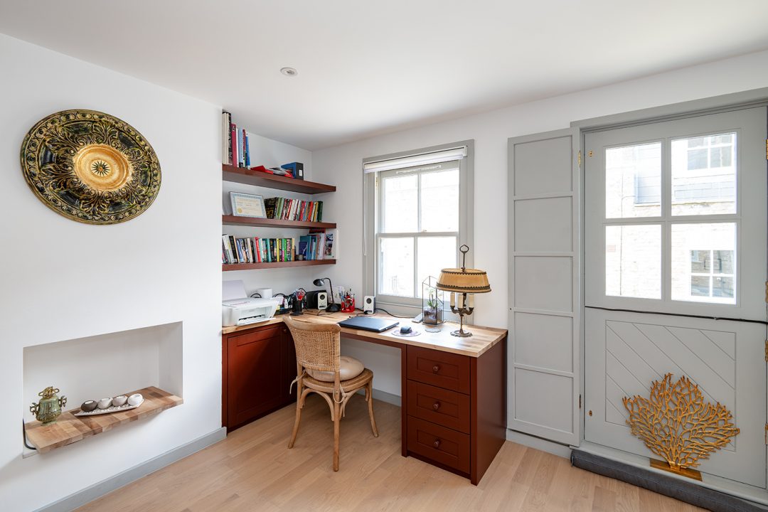 built in brown home office unit with shelves