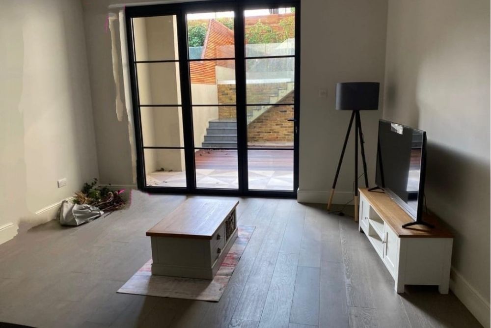 Empty wall space in living room in Ealing Broadway