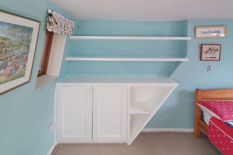 White alcove cupboard in bedroom