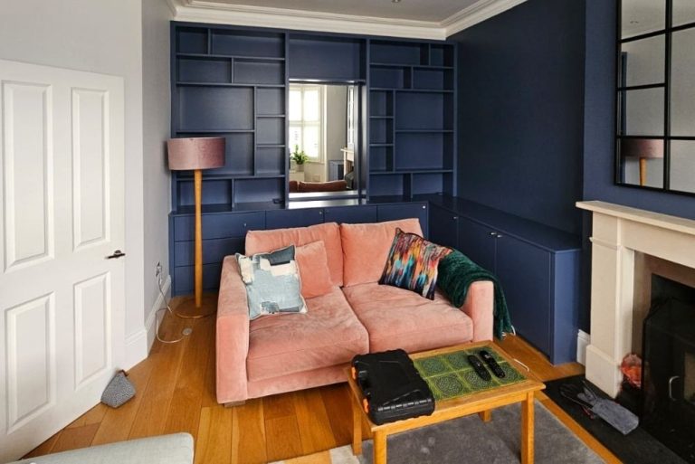 Blue fitted alcove cupboard and shelving