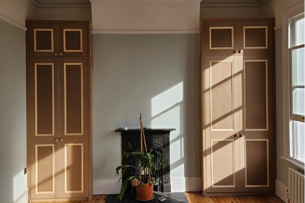 Two alcove built in wardrobes either side of fireplace