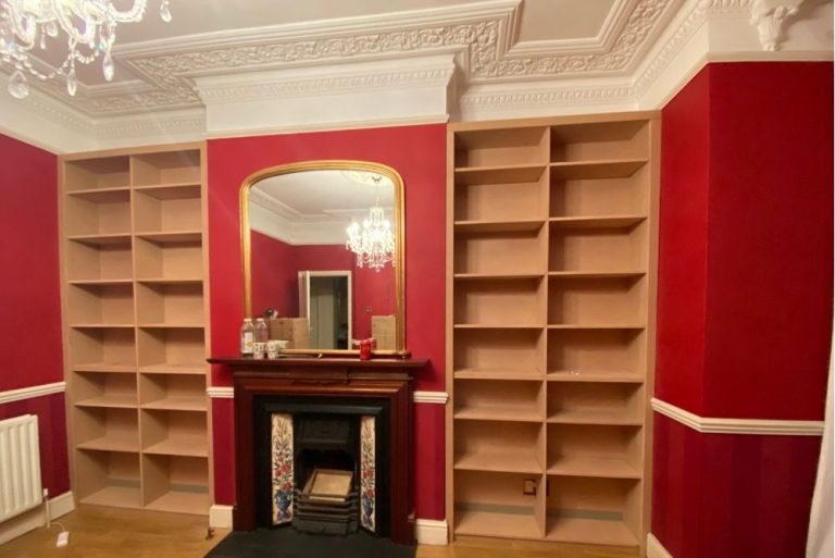 Alcove shelving either side of the fireplace