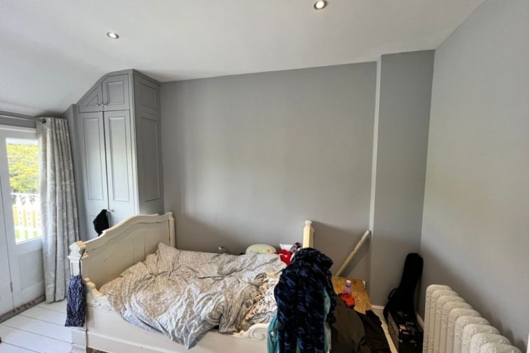 Bedroom with empty wall