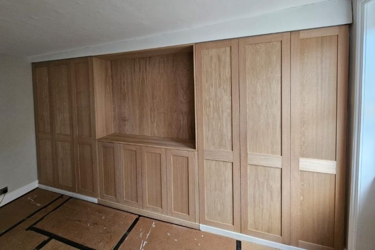 Large floor to ceiling wardrobe with gap for TV