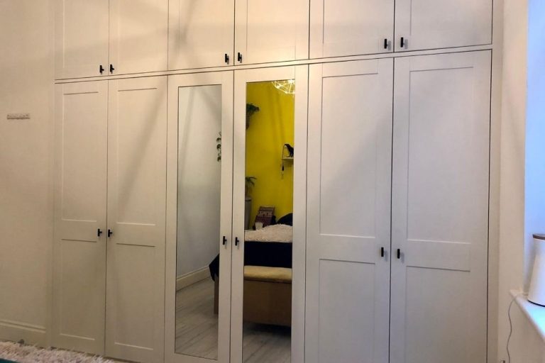 Large built in white wardrobe with shaker style doors