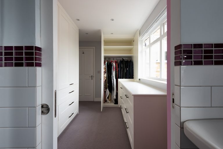 Internal view of wardrobe with clothes rail