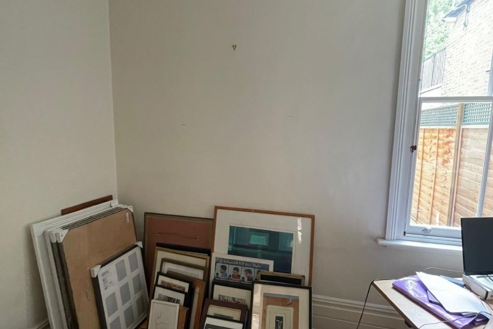 Empty wall with photo frames