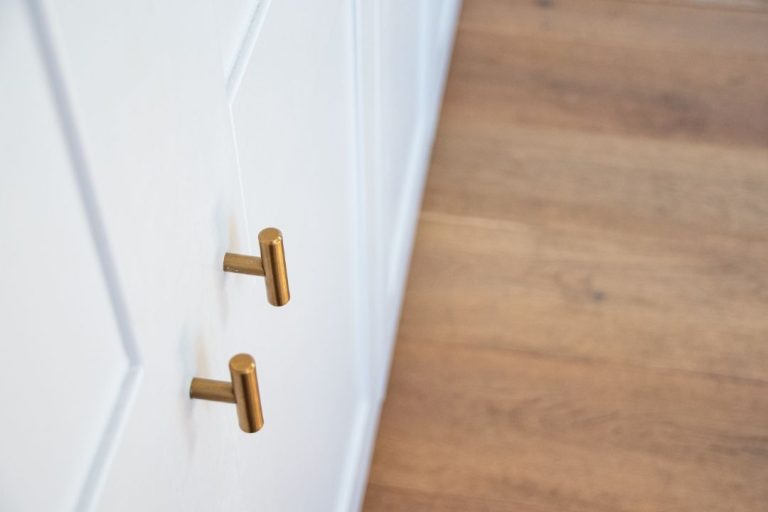 Gold door knobs to white cupboards