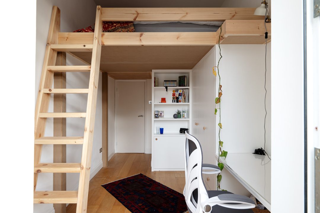 Built in loft bed with wardrobe. bookshelf, desk and ladder.