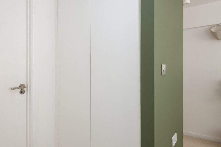 Wardrobe door with push catch